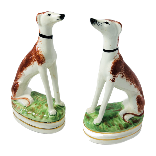H1 - Pair of Staffordshire Style Whippet Figures – Seated Greyhound Dogs on Grassy Bases